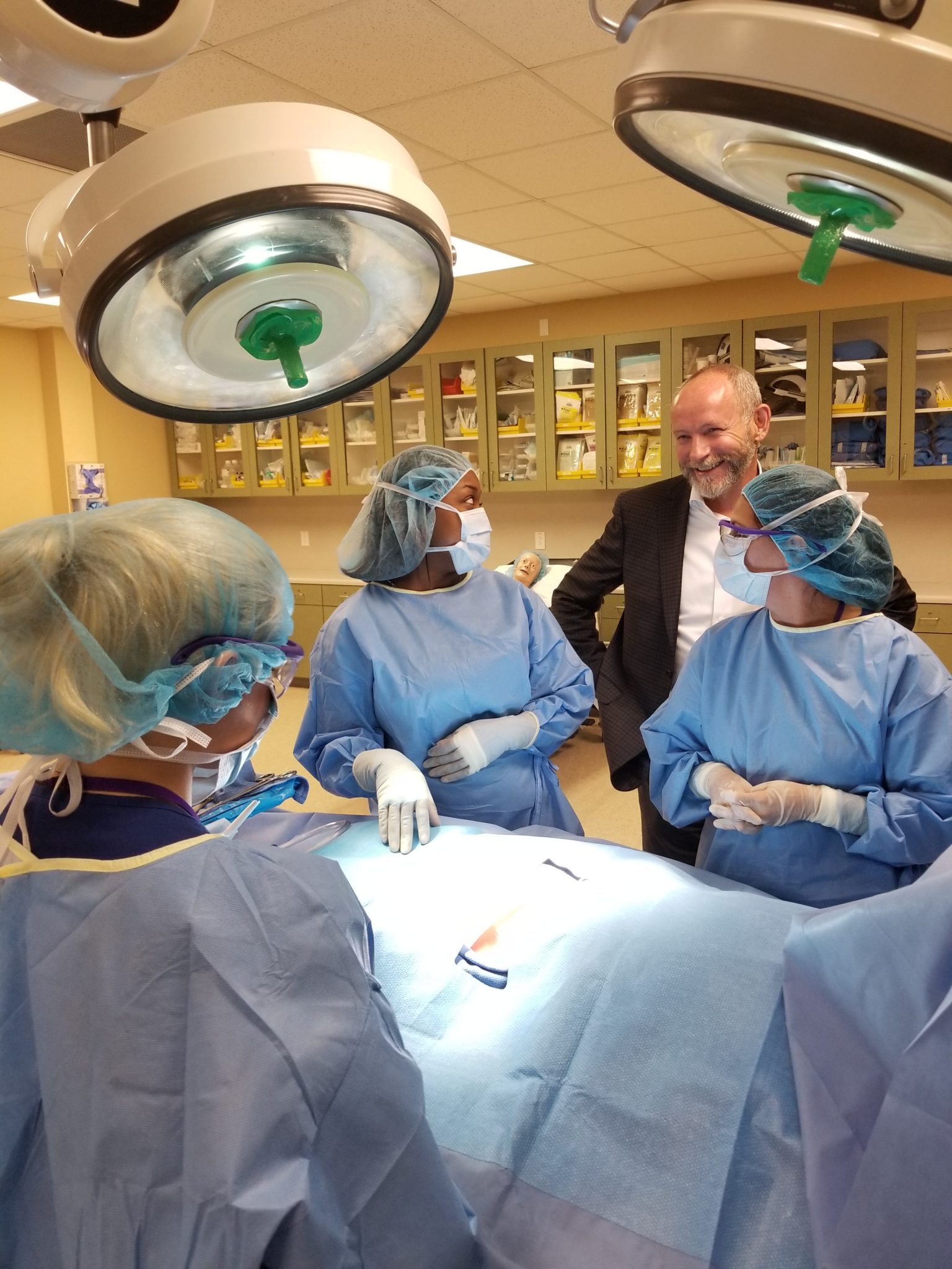 surgical technologist students with Guy Bell