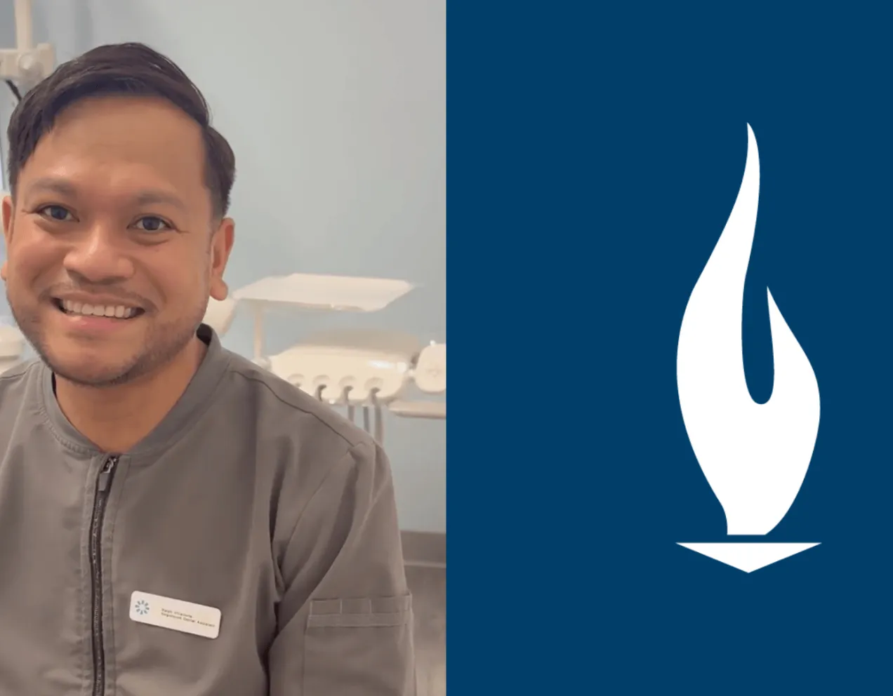 A male dental assistant with brown hair and wearing grey scrubs smiles for camera