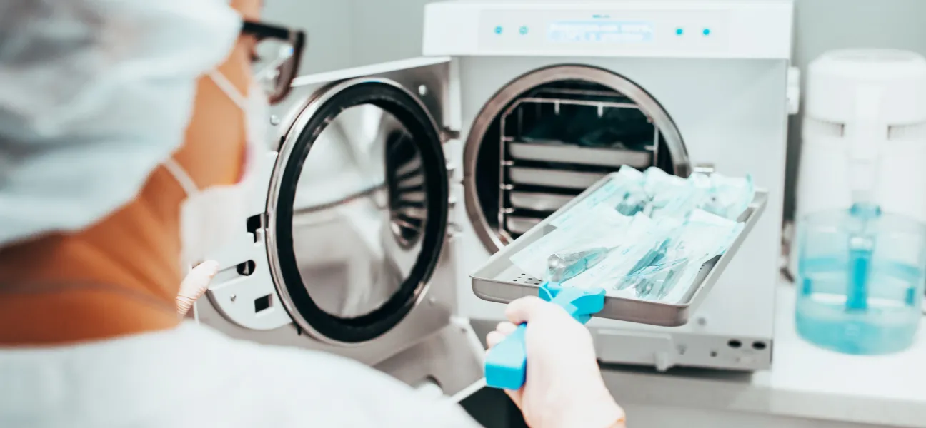 Sterile processing tech sterilizing medical instruments