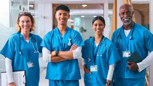 Nurses in a hospital hallway representing teamwork and various roles in the nursing field.