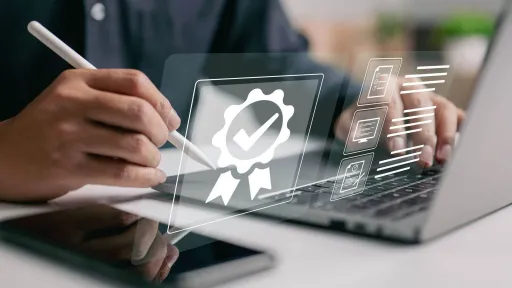 Person using laptop to explore medical office specialist certification options and training requirements online