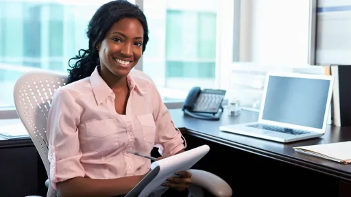 Medical office specialist working at a desk, showing the professional and administrative side of healthcare careers
