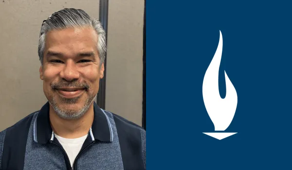 Jesus Solis, a respiratory therapist and instructor at Concorde San Antonio, smiles for camera in a headshot-style photo.