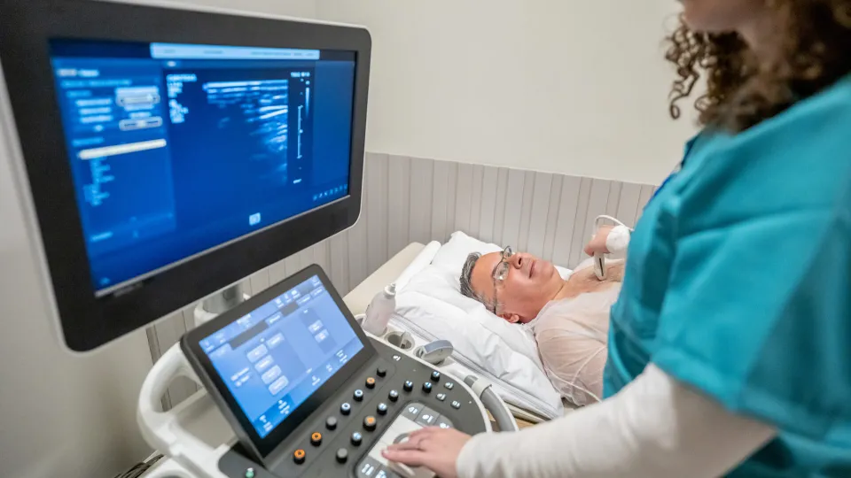An elderly patient undergoes a contrast-enhanced ultrasound to detect potentially diseased areas of tissue. An elderly patient undergoes a contrast-enhanced ultrasound to detect potentially diseased areas of tissue.