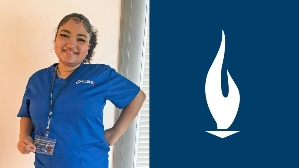 Daviana in blue Concorde scrubs smiling holding her student ID. Daviana in blue Concorde scrubs smiling holding her student ID.