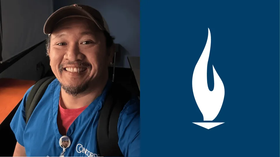 Portland Nursing graduate Arnold Septimo wearing blue Concorde scrubs and smiling for the camera Arnold Septimo wearing blue Concorde scrubs and smiling for the camera