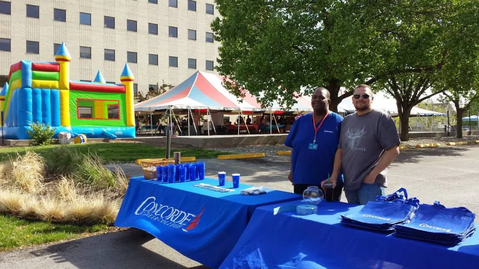 Concorde students in Kansas City greet visitors at a community health fair. Concorde students in Kansas City greet visitors at a community health fair.