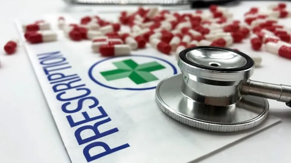 Certified Pharmacy Technicians prescription pad with pills and stethoscope