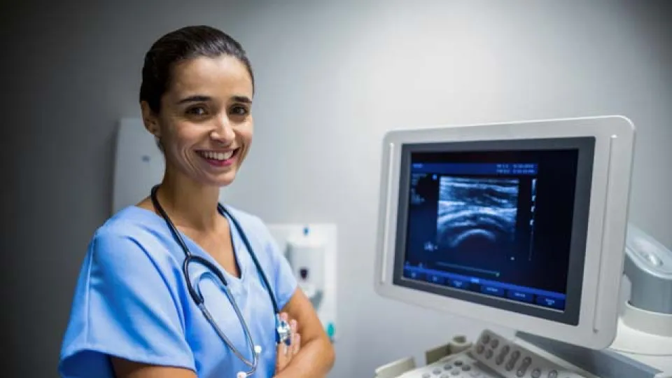 Nurse using ultrasonic monitor