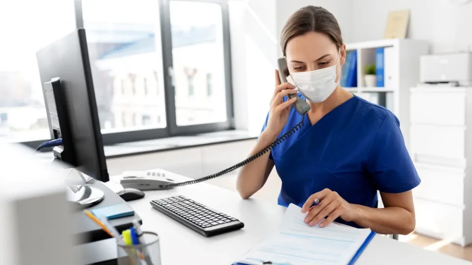 Non-beside Nusring jobs Nurse answering phone at computer