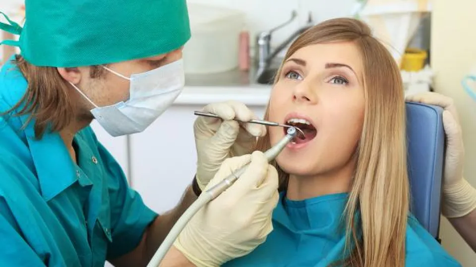 Patient gets teeth examined by hygienist. Patient gets teeth examined by hygienist.