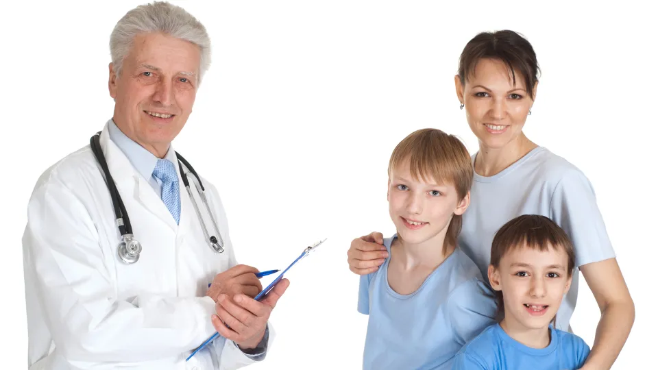 Portrait of young male doctor wearing headset while using computer at desk in clinic. Doctor. medical assistants