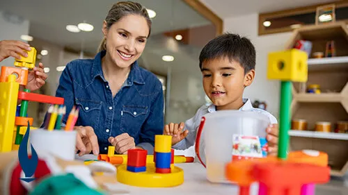 OTA working with young boy in school