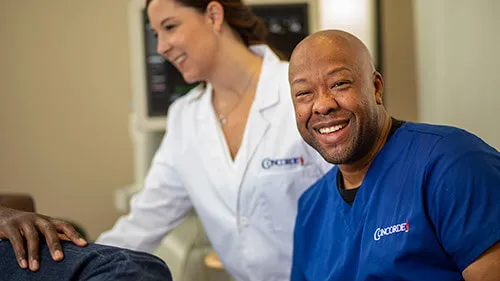 A cardiovascular ultrasound technologist smiles.