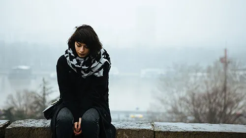 A woman experiences the symptoms of seasonal affective disorder, a form of depression that arises in response to seasonal changes.