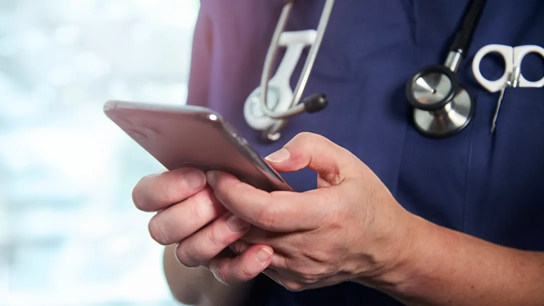 A nurse downloading a translation app