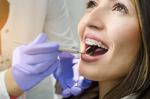 Dental Hygienist working in teeth